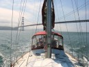 Calm waters as we pass under the San Francisco bridge. Friend Charles is at the helm. 