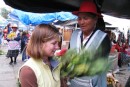 Heather takes part in a cleansing at the local market in Cuenca just as the locals do. You see here a medicine woman hitting her with a bouquet of local plants and herbs.