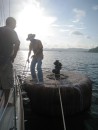 Canal Transit – Victor, our Traffic Advisor standing on a giant mooring ball on Gatun Lake. We spent one night here and finished the last third of the journey the following afternoon. 