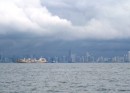 Panama City - Skyline and anchored cargo ship. 