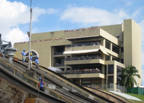 Canal Transit – Miraflores viewing platform and museum. Spectators watch as vessels move through the canal. 