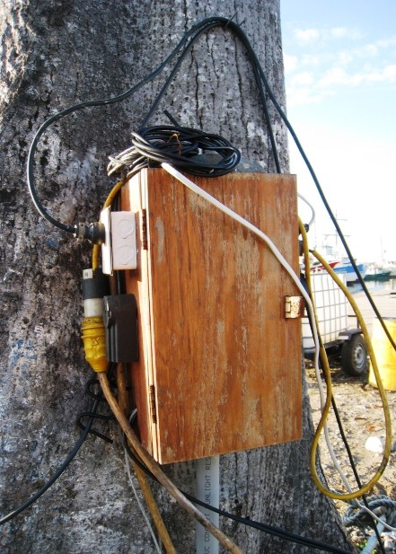 La Ceiba - Classic electrical set up for Central America. It is a box nailed to a tree with about 15 extension cords running into it. Not covered from the rain or sun and surely would not pass any code in the US - but it works just fine. 