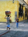 Antigua, Guatamala - Woman carrying her items, quite the common scene on the streets.