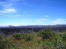Crater of an active volcano on Isabela Island. The black part is new lava from 2005.