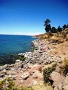 Isla Taquile on Lake Titicaca. Colorful laundry drying on the rocks. 