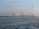 Fog rolling in at commercial docks to port