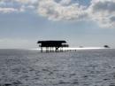 Stilt house on the reef.: My camera lens was dirty and apologize for the blurry picture.