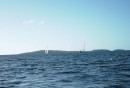 Sailboats in the distance enjoying Tongan waters.