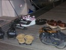 The pile of shoes on the dock means a happy gathering is going on aboard!
