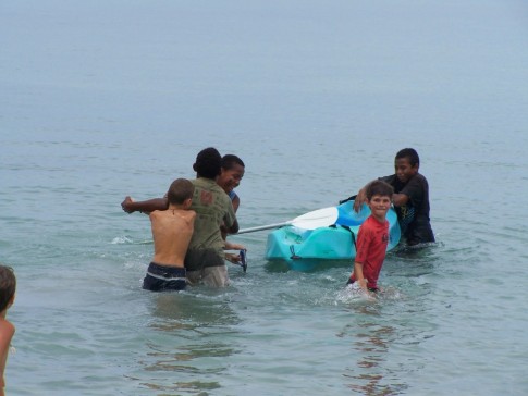 Wrestling over the kayaks (notice the difference in size of the Fijians and the rest of the world?!)