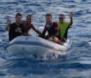 The boys from Wild One and Andy returning from snorkeling.