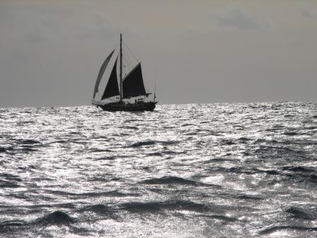 Yacht Ospray sails away from Ahe in the Tuamotus.