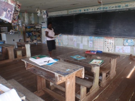 The principal/teacher in one of the primary school classrooms