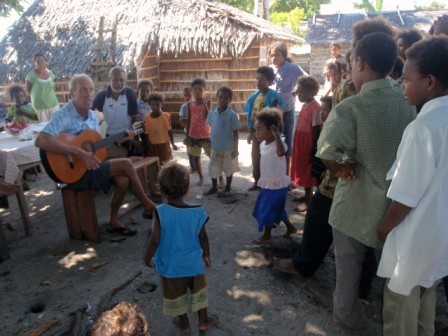 Jim sings his favorite song to the village kids