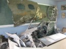 Recovered cockpit and nosepiece of the B-17E bomber "Naughty but Nice" which was shot down near Rabaul on 26 June 1943. All crew except her bombardier were lost. He was captured and survived prison camp.