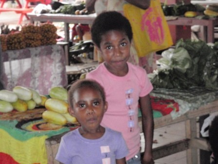 Couple of cute kids at the market