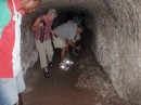Japanese tunnel near Rabaul. On the ground are dozens of bomb fuzes.
