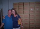 Mark and Janet in front of the boxes of tea ready to be shipped