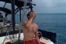 Our crew mate and World ARC staff member Joel Chadwick enjoys a refreshing natural beverage after the hard work of opening it.