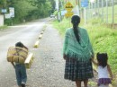 A typical Guatemalan family walking to market.