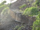 This wall was built across Petit Nevis to support a road from a pier to a hotel that was never built.