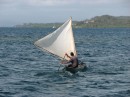 We see a sailing ulu and know we are back in the San Blas.  The steering mechanism is a paddle.