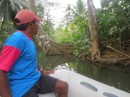 Arkin guiding us up a river to his plantation.