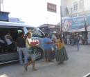 Market in Santa Elena.: These vendors came to the van to sell food.  Santa Elena is near Flores.  We stayed here before going to El Remate where we stayed at La Casa de Don David.  From there we did two day trips to Tikal.
