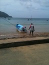 Fishing boat in Charlotteville with bamboo poles used for trolling.