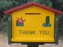 Donation box for the bathrooms at the National park with the symbols for the men