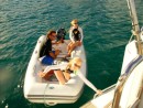 Allysia and Moriah driving the dinghy