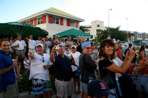 The crowd at the St Maarten Yacht Club watching Berkeley East and the mega yachts come through the bridge