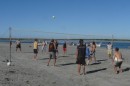 A beach party would not be complete without a volley ball game!
