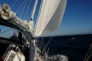 Broad reaching in 25-30 knots of wind with just the genoa.  Still doing about 8 knots!