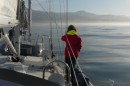 Beth watches for whales in the glassy water as we make landfall at San Simeon.