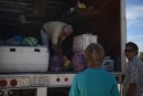 Man selling produce and groceries from his truck in Frailes.