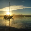 S/V Resilience with sun setting. (photo: Forrest Young)