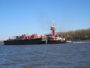 A very large barge and tug