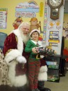 Santa gives Adler his gift.
