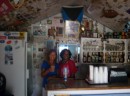 Jane and Violet, standing under the photo of Miss Emily.  Violet now runs the Blue Bee Bar.