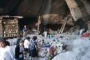 photo from inside cave.  There is kitchen and bedroom area and central area set up to display crafts and handmade goods