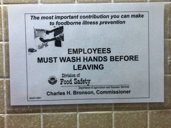 Charles Bronson, Commissioner of Food Safety, says wash your hands. Hey is the the same guy that was the actor in the movie "DEATH WISH" ? This sign is over the sink in the MEN