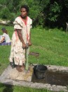 Woman pumping water
