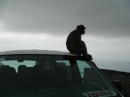 This monkey was happy sitting on the roof of the mini bus we were on
