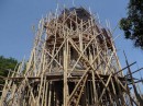 Construction underway of an addition to the temple, with bamboo scaffolding