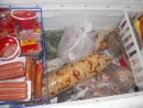 Freezer at the pink grocery store, the tube of yellow stuff is conch!