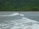 Carolyn catches her first wave at Playa Iguanita, Costa Rica. We learned the next day that a crocodile lives in the estuary at this beach!