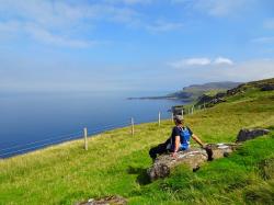 Canna view: Taking a rest on the walk around the island, look north across to Skye