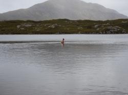 Is it Nessie?: No its Jay braving the water in the small loch below the hill Suilven. He didnt stay in long!