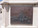 Statue in Maria Pita Square and the relief shows Drake